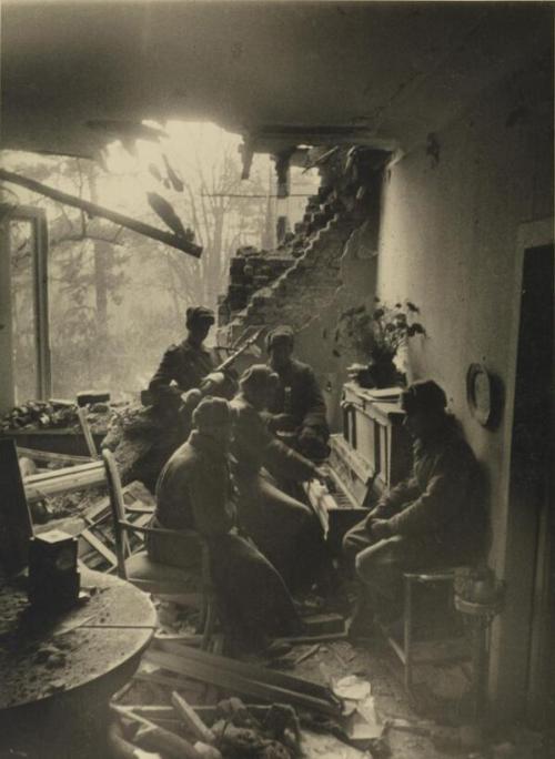 Russian soldiers playing piano in a wrecked living room in Berlin, 1945.Photo by Dmitri Baltermants