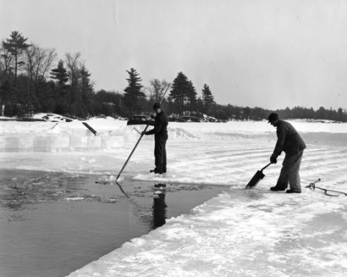 Man cutting ice with large saw embedded in river ice, pre 1960.via: Historic Photo Collection, F.P. 