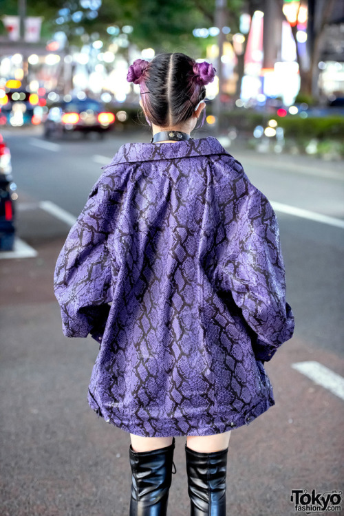 15-year-old Japanese student Megumi on the street in Harajuku wearing a matching purple snakeskin pr