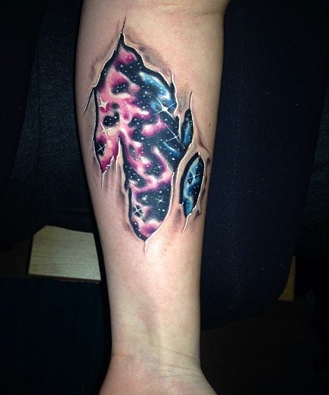 fuckyeahtattoos:  My skin tear/inner galaxy tattoo.  Mile High Tattoo (Thornton, CO) Done by Matt. 