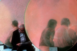 20aliens:  USA. Wall St. NYC. 1979. Coral colored disks used both as a work of art and as backrests. By Burt Glinn