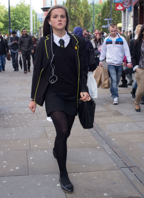 schooluniformfashions: A stylish school girl walks down a street.