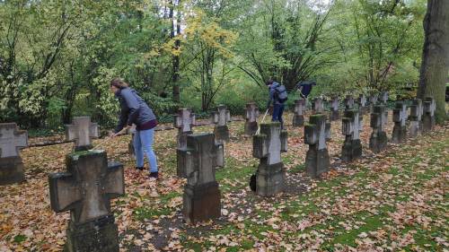 Here we are, volunteering at the cemetry, thinking on how best to express the difference between exc