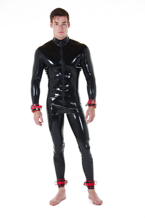 mentalaberration:  aaronrc:  Wow, what a handsome young rubber boy - show me more!!  Where’s the chains for his cuffs? 