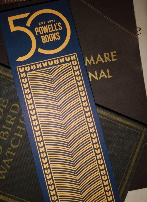 My latest haul from Powell’s Books: Their free 50th Anniversary bookmark, which I was pleased to see