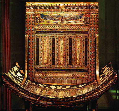 egypt-museum:Ceremonial Throne of TutankhamunThe high curved back is fitted to a stool with crossed 