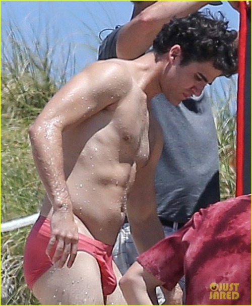 celebritybodybuge:  Darren Criss Part 1 Darren Criss in a red speedo as Andrew Cunanan on the set of The Assassination of Gianni Versace; American Crime Story.