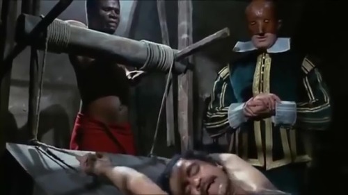 Isabella, duchessa dei diavoli (1969)A sweaty, hairy-chested captive takes a turn on the rack.