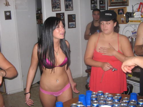 A fun strip flip cup game - the girls are already down to bras and thongs at the start of the photos