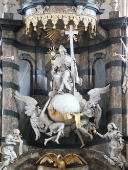 theraccolta:  (Church of Our Lady across the river Dijle) in Mechelen, Flanders, Belgium. The figure is an allegory on the Roman Catholic Church carrying the Blessed Sacrament and the Cross.