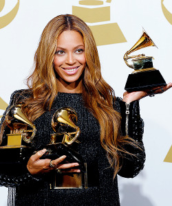 ikonicgif: Beyonce holds the awards she won