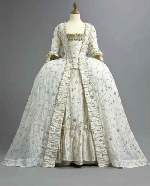 Court GownC. 1770’s. Fine white Indian muslin with silver metal embroidery, the robe sack-back