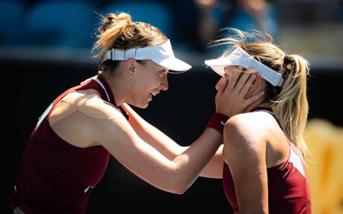 Paula Badosa and Marta Kostyuk embrace at the net after their 3rd round match at the 2022 Australian