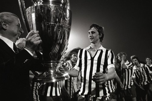 Johan Cruyff, clad in a swapped Juventus kit, accepting Ajax’s third successive European Cup in 1973