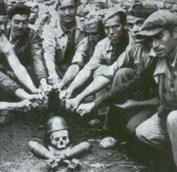 the-anarcho-raver: Anarchists gathered around a fascist skull during the Spanish civil war.