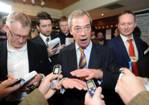 Nigel takes a break from laughing to show a room of men a new dance he invented while watching Towie