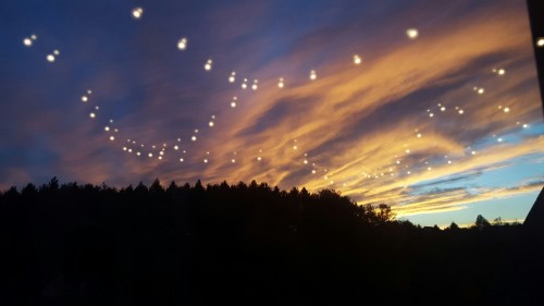 groovyherbs:  thesevibesseemfine:  penizpizza:  The lights in my room reflected from my window and looked amazing in the sky   Aliens  This is enchanting