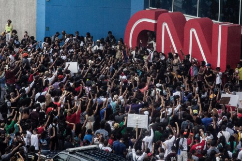 candidinatlanta:  “As the protesters marched through the streets, it began to storm. Every time the thunder crashed, the protesters would cheer louder and louder. It seemed as if mother nature herself were cheering them on..” 