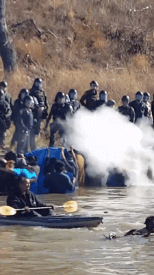 fancyladssnacks:gogomrbrown:#NoDAPL protestors teargassed while standing peacefully in the water. US