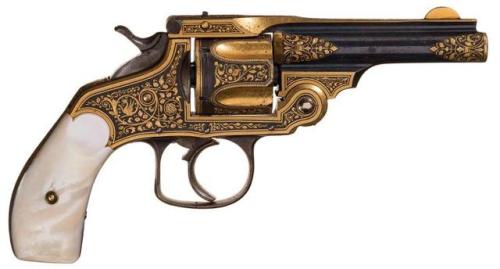 Gold damascened Spanish copy of a Smith &amp; Wesson revolver with pearl grips. Marked &