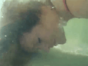 Women Blowing Bubbles Underwater