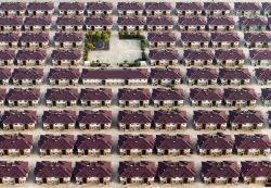 China, rows of identical houses, with a playground