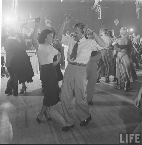 Cutting loose at an art directors party(Allan Grant. 1950)