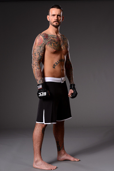 thepunknation:UFC Photoshoot Part Two‘DALLAS, TX - MARCH 13:  Phil ‘CM Punk’ Brooks poses for a photo during a UFC photo session at the Hilton Anatole Hotel on March 13, 2015 in Dallas, Texas. (Photo by Mike Roach/Zuffa LLC/Zuffa LLC via Getty