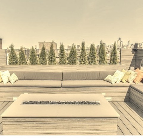 Chicago DeckPhoto Of A Massive, Unadorned Rooftop Deck With A Fire Pit And No Covering