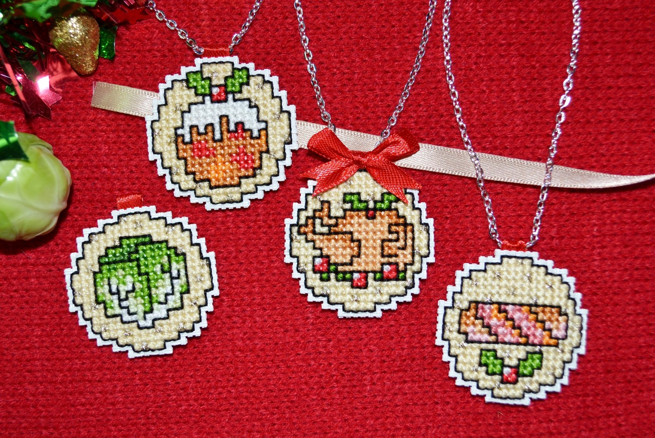 Here’s how to make some Christmas dinner themed pendant necklaces! Cross stitch a pudding, turkey, brussels sprout and a pig-in-blanket.
You will need some 13-count vinyl Aida (DMC/Charles Craft), one scrap of ribbon per pendant, and a necklace chain...