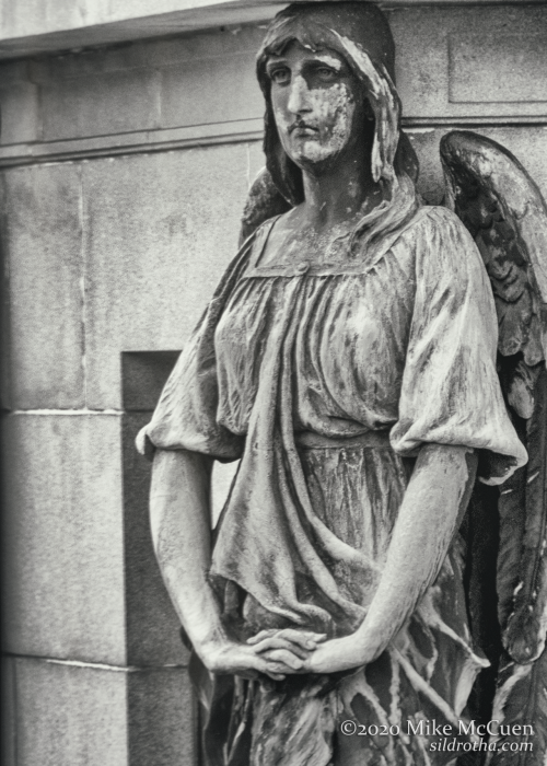 A seemingly despondent caryatid.Rock Creek CemeteryWashington, DC