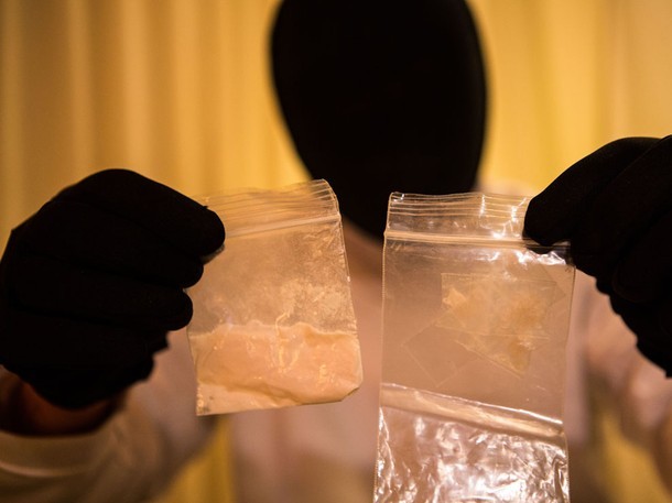 drugwar:  The Dealer A masked NYC dealer with a tray of heroin. New York is America’s