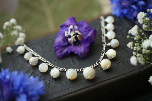 Antique white rosary mother of pearl beads made into an elegant sterling silver necklace.Available a