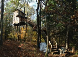 cabinporn:  Treehouse in Swanzey, New Hampshire. Contributed by Matt Beckemeyer who writes:  It was built by a friend’s roommate, has a bottom floor and a loft attic, two small balconies, and a wood pellet burning stove. It’s used primarily as an