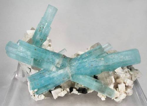 The BowtieAquamarine crystals drape over a matrix of beautiful rhombs of potassium feldspar, with a 