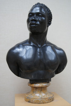 medievalpoc:  Studio of Francis Harwood (in Italy) Portrait Bust of a Black Man England, Italy (1758) Black Stone and Yellow Siena Marble, 2 ft. 3 1/2 in. x 1 ft. 7 3/4 in. x 10 1/2 in. Info via Getty Museum:  With noble bearing, this man proudly holds