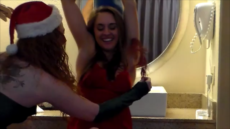 Naughty Mrs. Claus and Elf HD Part 2                                                                                                                                            The Elf  (Bianca Rose) contiues her tickling punishment on Mrs Claus (Ava).