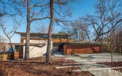 luxe-interiors-and-design:  A Modern Dallas Home With Wood And Stone Exterior Wood and stone allow a modern Dallas home to embrace its forested hilltop setting and create a warm backdrop for an impressive art collection. Read about this home. / Tour this