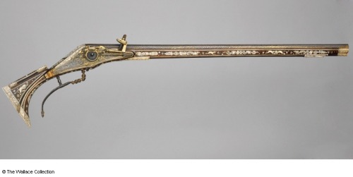 A rare breechloading wheellock rifle decorated with antler, gold, and various engravings with a waln