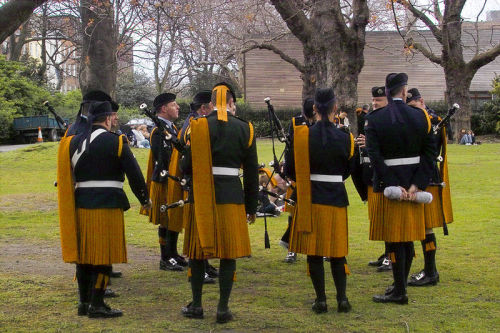 sartorialadventure:Irish Defense Force pipers in saffron kilts