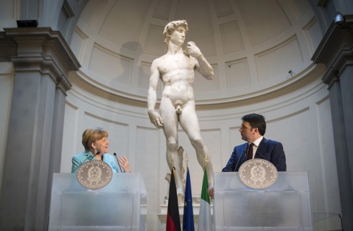 Handout/Getty Images German Chancellor Angela Merkel and Italian Prime Minister Matteo Renzi hold a 