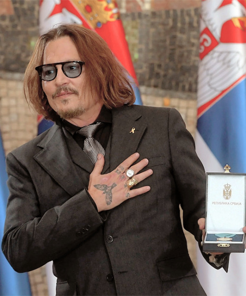 JOHNNY DEPP.Receiving a Gold Medal of Merit in Belgrade.