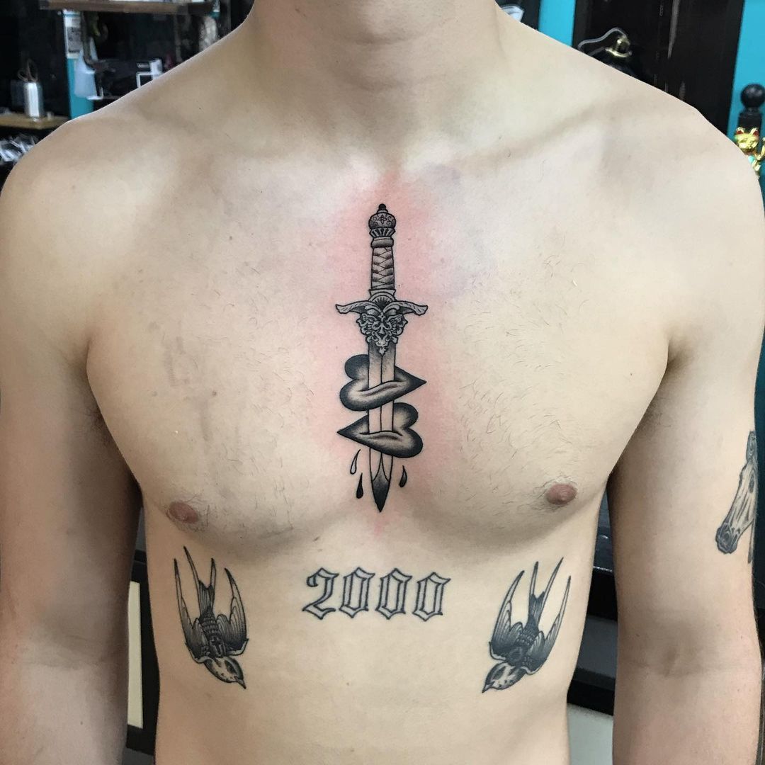 Traditional dagger tattoo inked on the sternum and belly | Traditional dagger  tattoo, Dagger tattoo, Tattoos