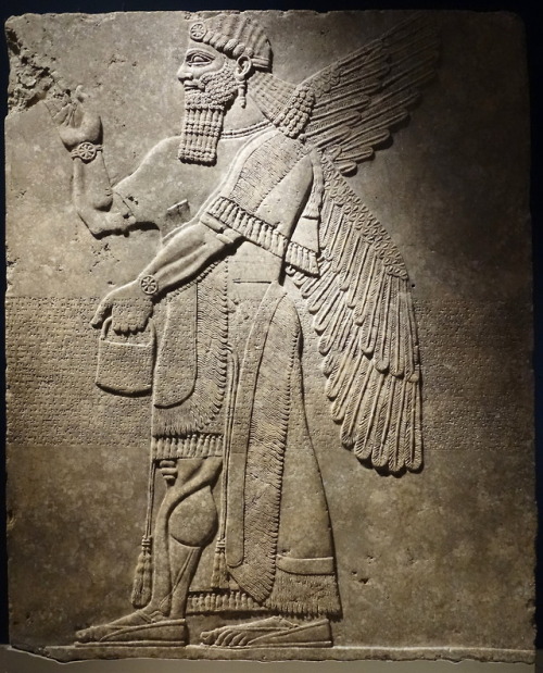 Assyrian “winged genie” with elaborate bracelets.  Alabaster relief sculpture from Room H of the Nor