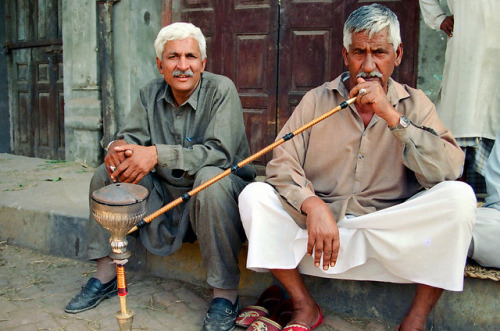 pakistan365:Pakistan (Khyber Pakhtunkhwa-Punjab) by gromanuk on Flickr.Man smoking flavoured tobacco