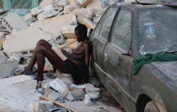 woman reading in the aftermath of the earthquake