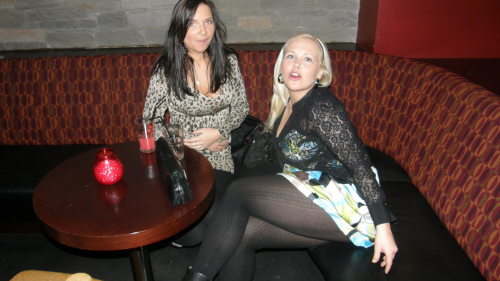 Clubbing girl flashing legs in black pantyhose.Woman in pantyhose