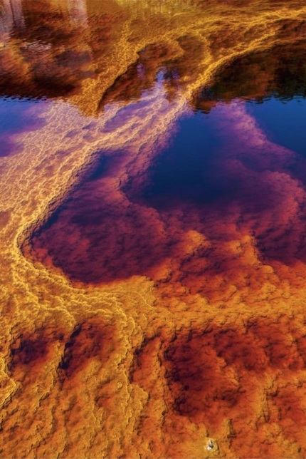nubbsgalore:  a river runs through it. and by it, i mean a five thousand year old copper, silver and gold mine in huelva, spain that renders the tinto river alien and lava like in appearance, a result of the oxidation of iron and sulfur minerals by the