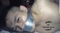 mr-tapegaggedasians:       My sexy Chinese Beijing slave all tied up and tightly tape gagged with strong silver duct tape 