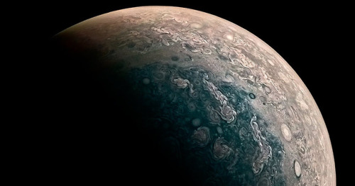 Jupiter is perpetually covered with clouds composed of ammonia crystals and possibly ammonium hydros